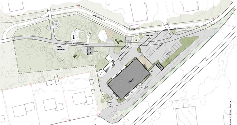 skiss över en tänkt ny förskola i ett parkområde