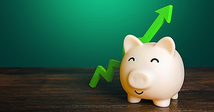 En spargris och en grön kurva med pil som pekar uppåt.