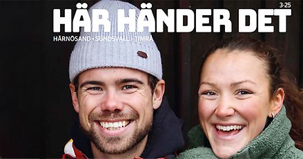 En hand som plockar ut en tidning ur en brevlåda. Grön buske och grus i bildens bakkant.