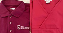 Närbild på arbetskläder med Härnösands kommun logotyp på.